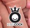 King Cock Logo in front of naturalistic Dildos